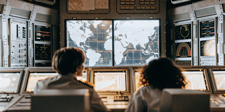 Dashboards in a security operations center displaying data from an enterprise security platform.