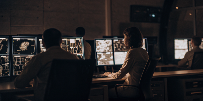 A threat management platform displaying real-time threat data for analysts in a security operations center.