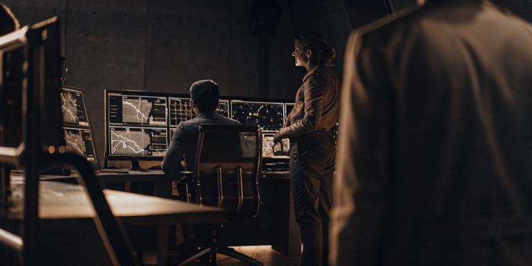 Analysts comparing legacy vulnerability scanners vs. threat exposure management on a data dashboard.