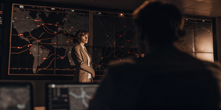 Security team analyzing a threat map for vulnerability management vs exposure management prioritization.