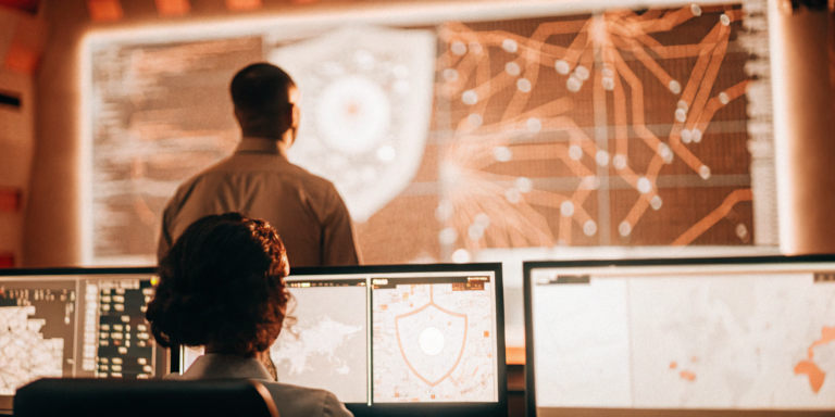 Security analysts reviewing vulnerability management dashboards for a Cisco replacement.