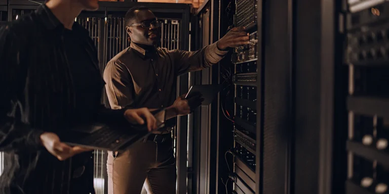 HiveForce Labs team analyzing server racks for proactive threat and vulnerability intelligence.